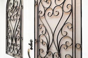 A metal gate with intricate designs. - Honmachi 5-chome (Tokyo)
