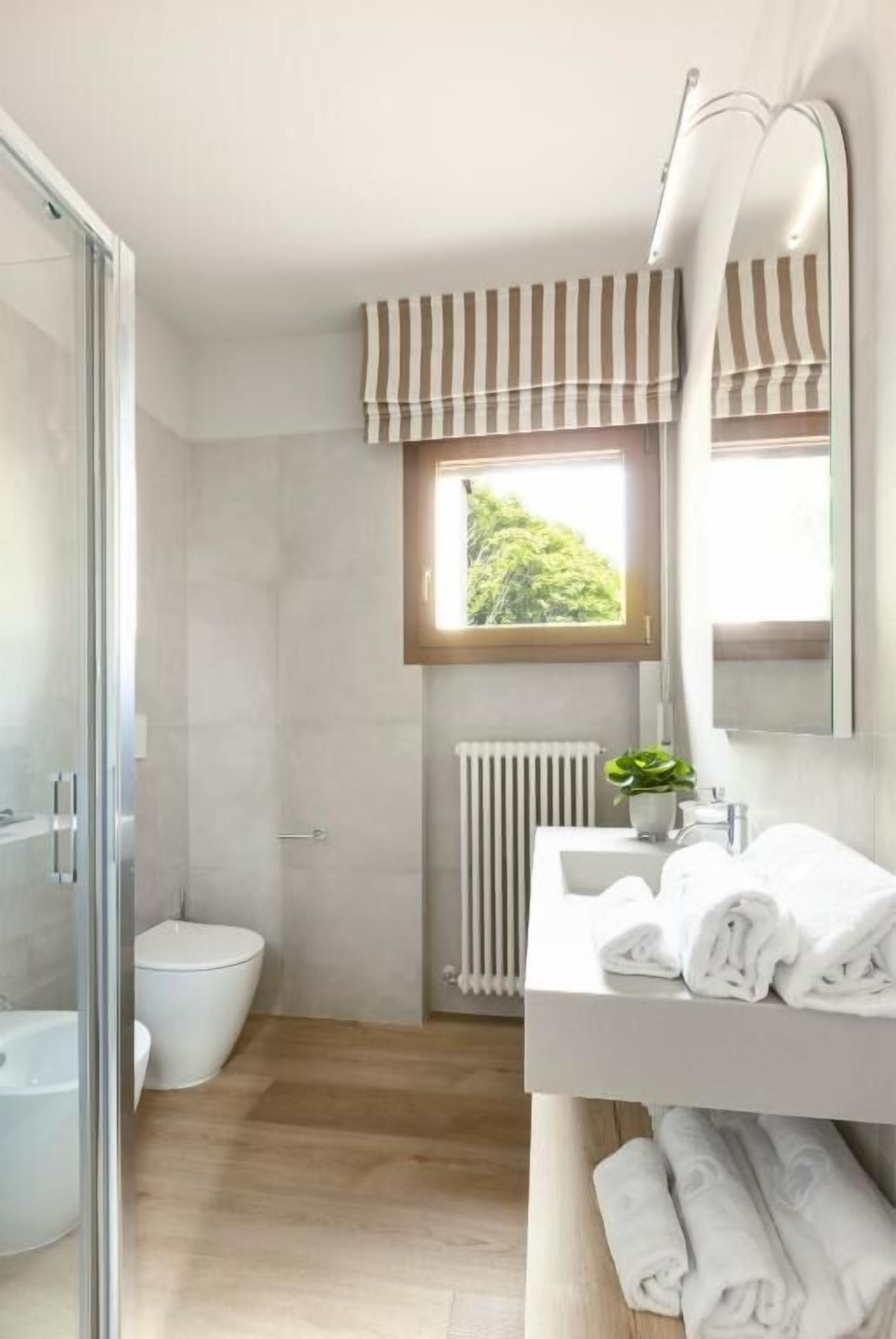 Shower, hair dryer, slippers, towels