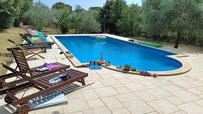 A swimming pool with lounge chairs and poolside amenities. - Villa Morus by Villas Guide (Svetvincenat)