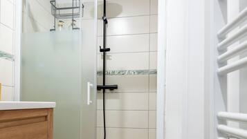 Shower, towels, soap, toilet paper