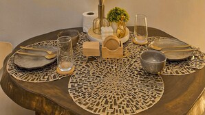A table with a decorative centerpiece, a framed inspirational quote, and a vase with dried plants. - Shore 2 Cozy Staycation, Pool View, Near MOA and NAIA Airport w/ Netflix (Pasay City)