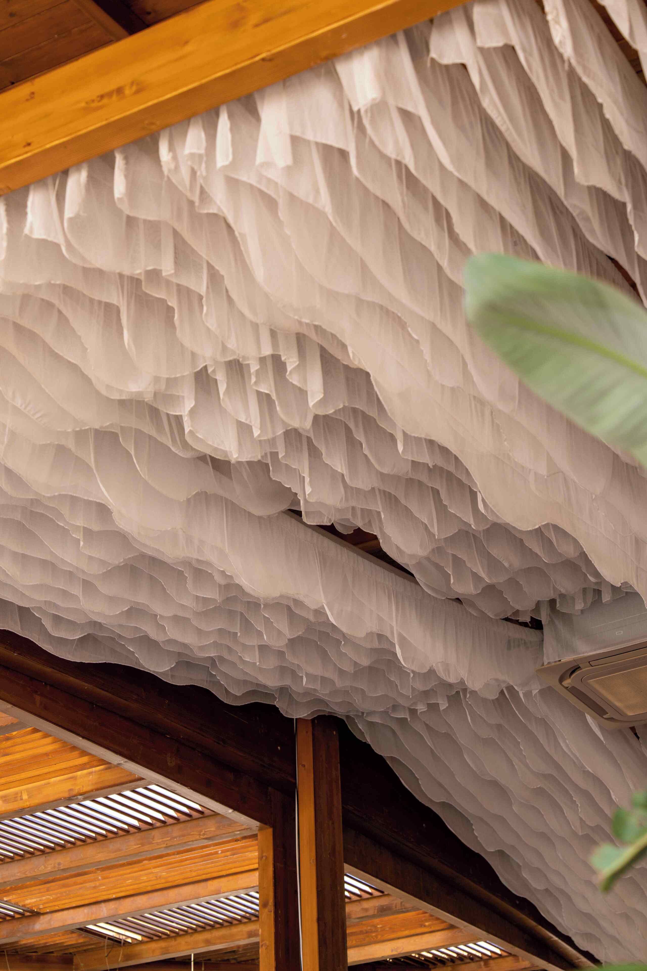 A ceiling with a textured, layered design.