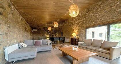 Designed 16th-century farmhouse among open fields