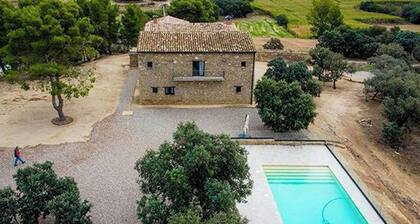 Designed 16th-century farmhouse among open fields