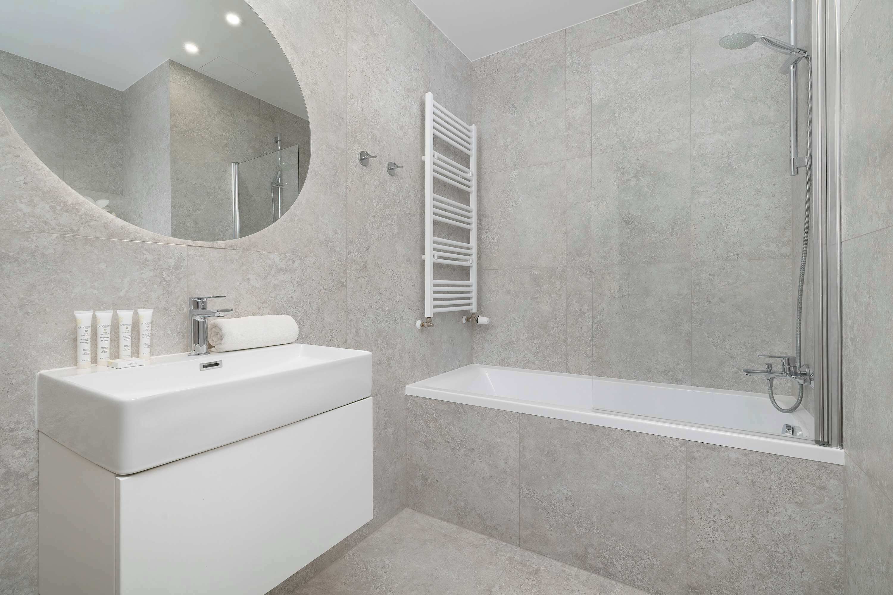 Shower, hair dryer, towels, shampoo