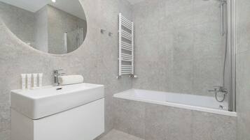 Shower, hair dryer, towels, shampoo