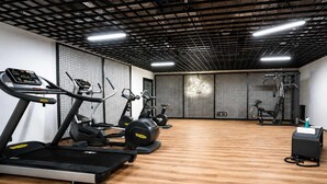 A gym with treadmills, elliptical machines, and weight equipment. - Śląska 416 | Gym | AC & Parking (Gdańsk)