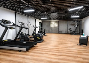 A gym with treadmills, elliptical machines, and weight equipment. - Śląska 416 | Gym | AC & Parking (Gdańsk)