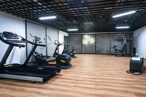 A gym with treadmills, elliptical machines, and weight equipment. - Śląska 406 | Gym | Perfect for Couples (Gdańsk)