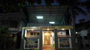 A two-story building with a sign reading 'SRIPATHI HOME STAY'.