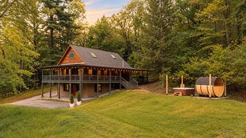 Everything you need is right here, from the big wraparound deck to the hot tub and sauna next door.