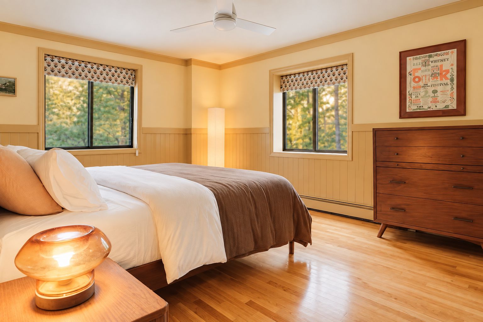 Wake up to the trees outside two big windows, with a roomy dresser to unpack your things.