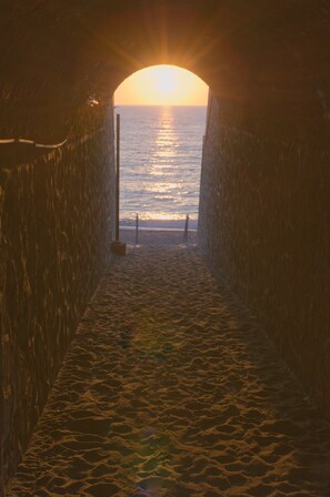 A tunnel leading to a beach with a sunset view. - A villa with a view of the sea, surrounded by nature, tranquility, and relaxation in the heart of Sicily. (Santo Stefano)