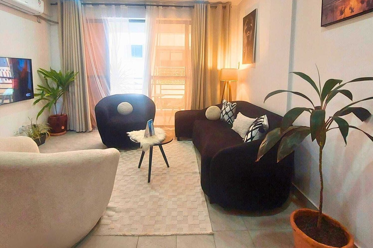 Apartamento Deluxe | Zona de estar | Smart TV de 32 pulgadas con canales digitales