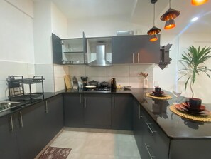 Apartamento Deluxe | Cocina privada