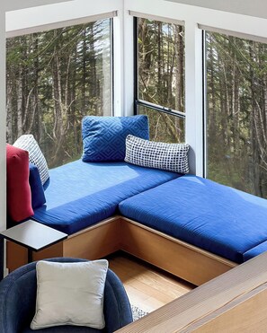 A room with a built-in bed, large windows, and a view of a forest. - Sea Ridge (TOT ID #2175): 3  BR, 3  BA House in The Sea Ranch, Sleeps 6 (The Sea Ranch)