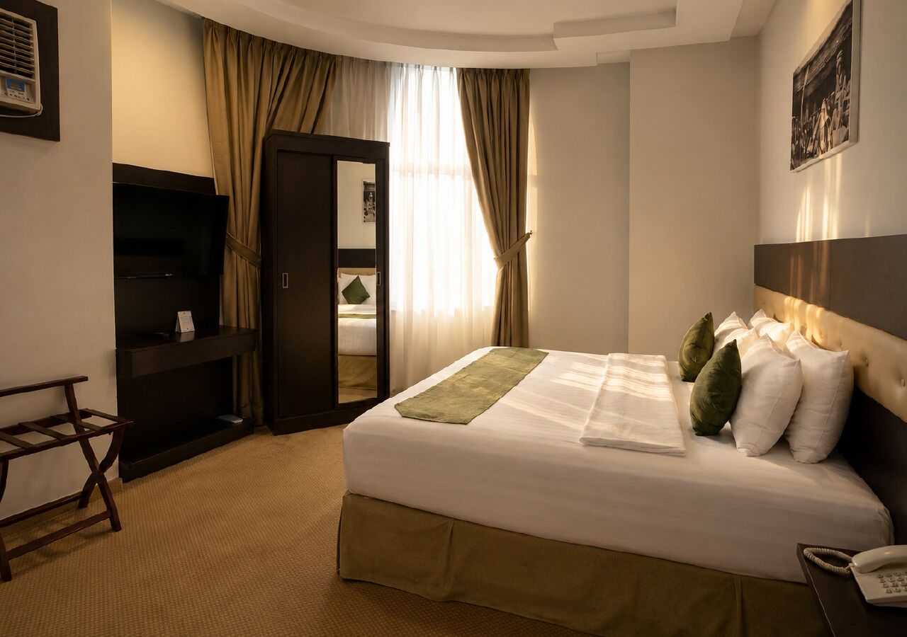 Suite Deluxe | Tabla de planchar con plancha y wifi gratis 