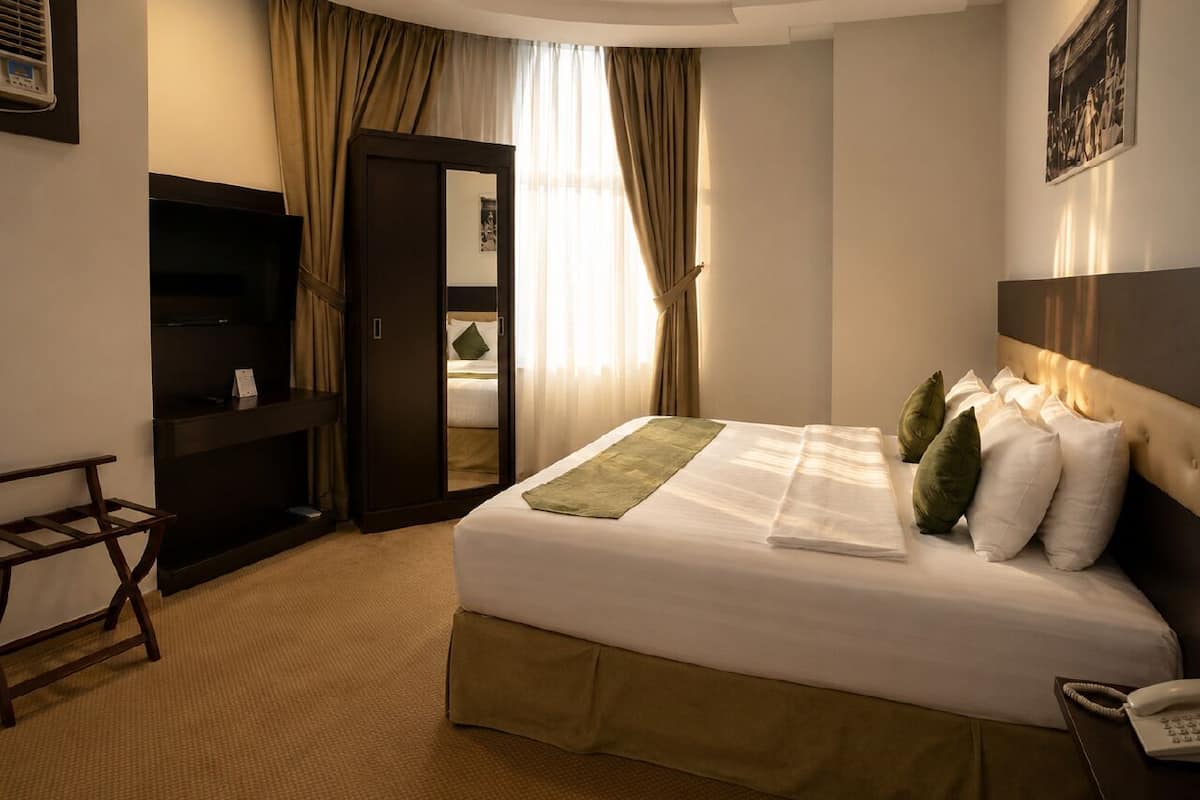 Suite Deluxe | Tabla de planchar con plancha y wifi gratis 