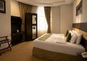 Suite Deluxe | Tabla de planchar con plancha y wifi gratis 