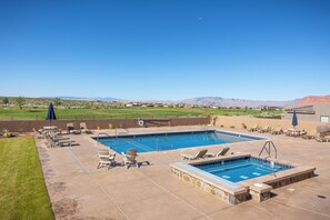 A pool area with two pools, lounge chairs, and a view of mountains. - The Approach Shot: 4  BR, 4  BA House in St. George, Sleeps 10 (St. George)