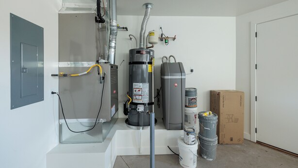 A room with a water heater, a boiler, and a boiler room door. - The Approach Shot: 4  BR, 4  BA House in St. George, Sleeps 10 (St. George)