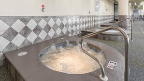 A hot tub with a metal railing, a tiled wall with a diamond pattern, and a 'No Smoking' sign. - The Oasis 706 Formerly Phoenix West Ii 706 3 Bedroom Condo (Orange Beach)