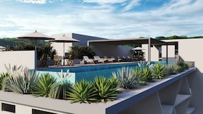 A modern outdoor pool area with lounge chairs and umbrellas. - Stylish 2BR | Beach & Town Nearby | 2nd Level (Huatulco)