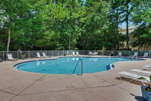A circular pool with a no diving sign, surrounded by a fence and lounge chairs. - Near Grand Boulevard & Beaches! Coastal Condo (Miramar Beach)