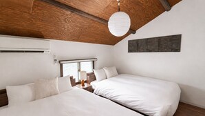 A hotel room with two beds, a wooden ceiling, a window with a view, and a wall-mounted artwork. - AYA - Self Check-In Only (Osaka, Chuo Ward)