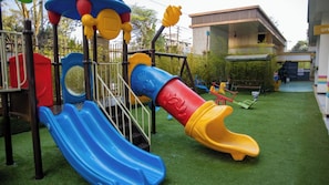 A playground with slides and climbing structures. - Luxury Two bedroom Apartment  in  kileleshwa (Nairobi)
