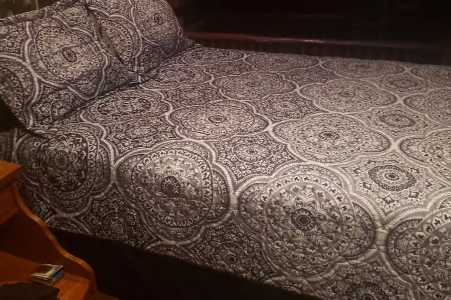 A sofa with a patterned fabric.