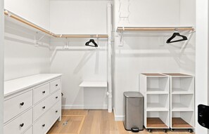 A walk-in closet with a white dresser, open shelving, and a trash bin. - 4 Peaks Post | 25min to Grand Targhee, Sleeps 18, Hot Tub, Views! (Tetonia)