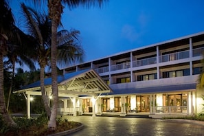 A multi-story hotel with a covered entrance and outdoor seating area. - A Place You'll Surely Enjoy! Full Kitchen, Outdoor Swimming Pool Near Key West (Duck Key)
