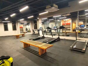 A gym with treadmills, benches, and exercise equipment. - Reserva del Mar II Apartment - Cantamar SOHO -391A (Santa Marta)