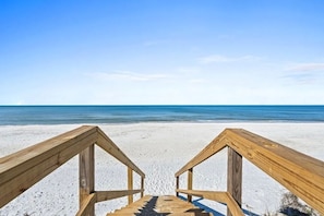 A wooden staircase leading to a beach with a clear blue sky. - Aloha House – Gulf-Front Retreat on Cape San Blas (Cape San Blas)
