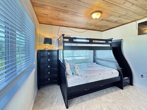 A bedroom with a bunk bed, a dresser, and a window with blinds. - The Lookout: North Cape, 3 Bedrooms, Pet-Friendly, Private Pool! Short walk to b (Cape San Blas)
