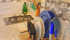 Coffee/tea maker, fridge, microwave, cookware/dishes/utensils