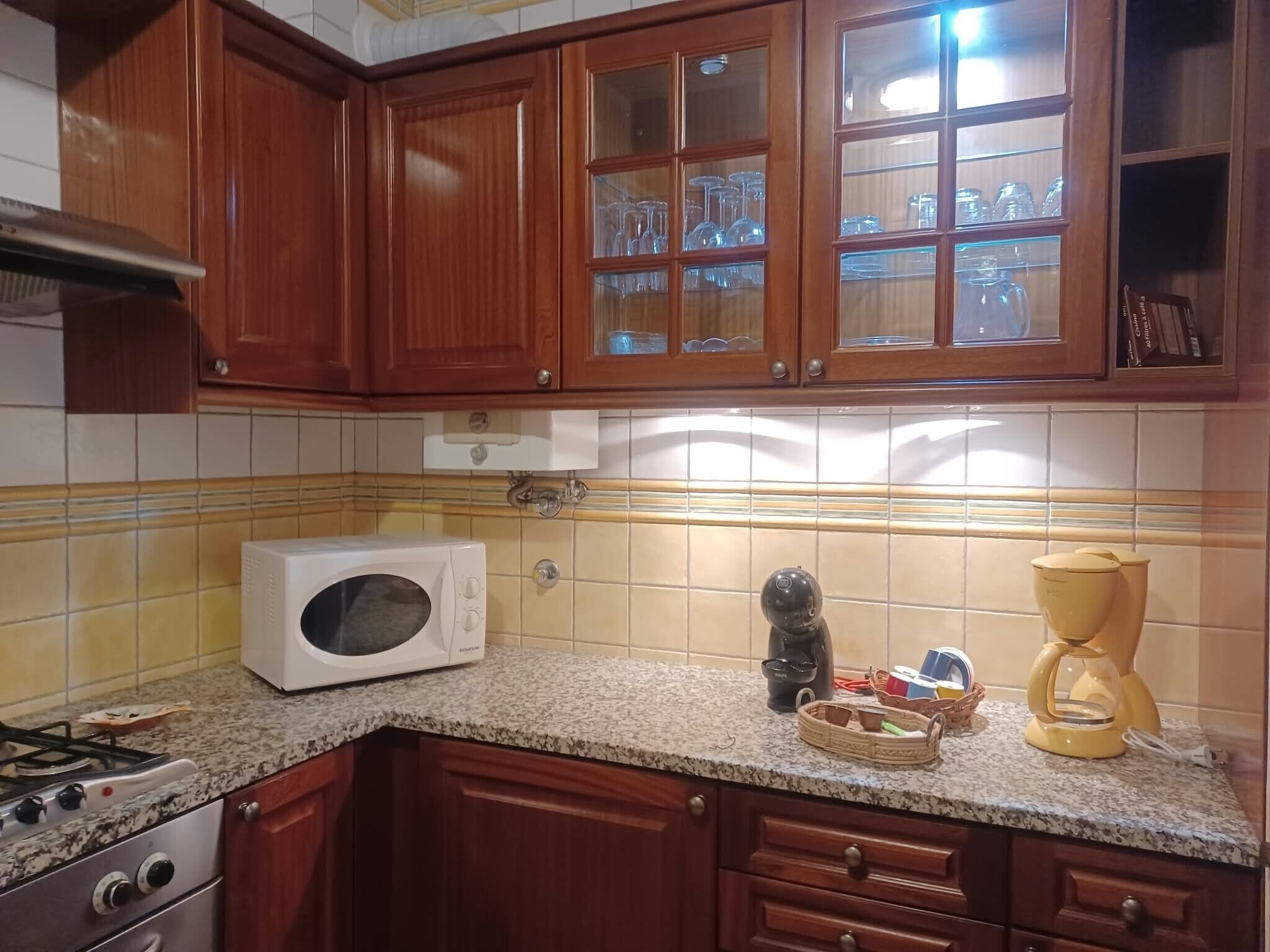 Coffee/tea maker, fridge, microwave, oven
