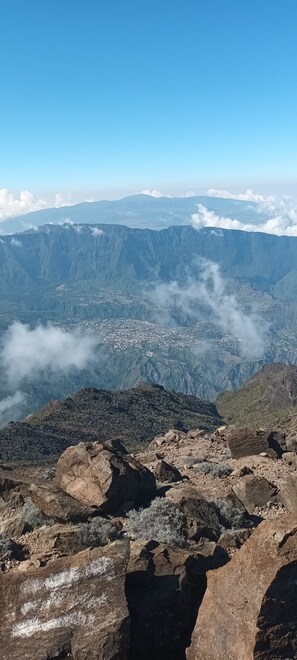 A mountainous landscape with a town nestled in the valley below.