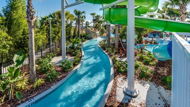 A water park with multiple slides and a pool. - Sleeps 14 *Private Pool *Arcade Games *BBQ Grill (Davenport)