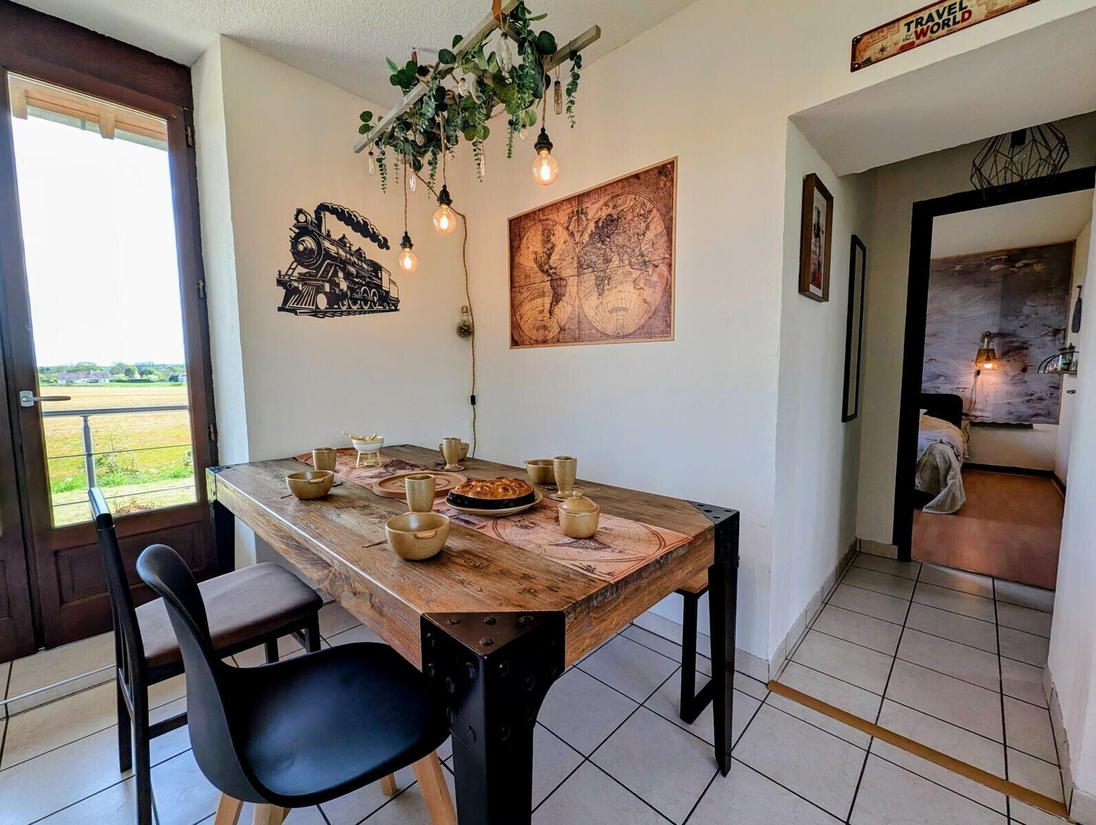 A dining area with a wooden table, chairs, and a map on the wall.