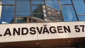 A building with the sign 'LANDSVÄGEN 57' indicating its address. - Nordhaven Sundbyberg (sundyberg)