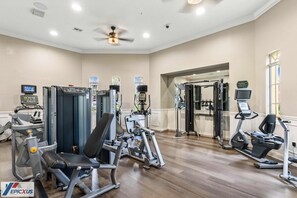 A gym with various exercise equipment, including cardio machines and weightlifting stations. - The Epic 48108 Lake View Vista Cay Resort Orlando Florida (Orlando)