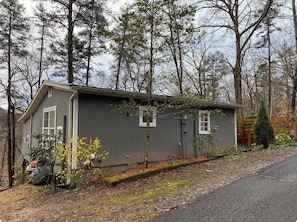 A small, single-story cabin with a sloped roof, surrounded by a wooded area. - Two Cottages in the Woods! 4 mins to Dahlonega Square (Dahlonega)