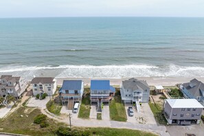 A coastal residential area with houses, a beach, and the ocean. - Dog-friendly oceanfront escape (North Topsail Beach)