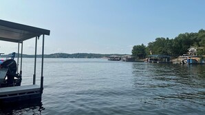 A calm lake with a dock and a covered area. - Timber Ridge - Three Bedroom House, Sleeps 8 (Village of Four Seasons)