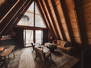 TV, fireplace - Lake Huron A-Frame | Sunset, Firepit + Cozy Vibes (Ocqueoc)