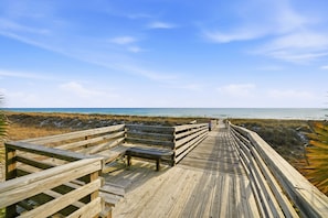 A wooden boardwalk leading to a beach with benches. - 3 King Beds*Resort Pool*Private Beach Access (Panama City Beach)