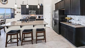 Coffee/tea maker, fridge, microwave, oven