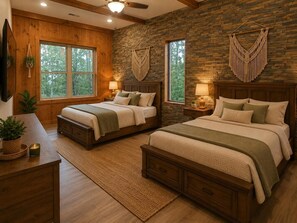 A bedroom with two beds, wooden flooring, a stone wall, and large windows. - Brand NEW Luxury 3/3.5 Cabin! AMAZING VIEW! Indoor Pool, Huge Game Room, WIFI. (Gatlinburg)